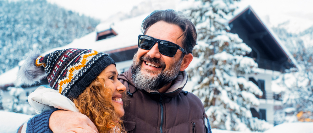 A man and woman outside in the snow