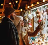 Man and woman looking at Christmas ornaments