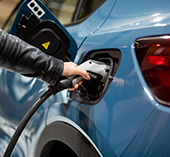 Person plugging in their electric car