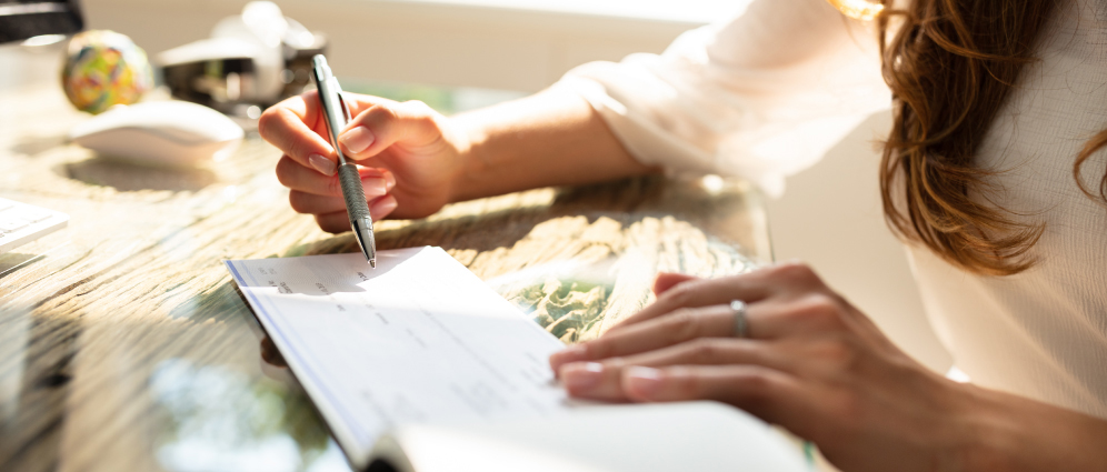 Woman writing a check