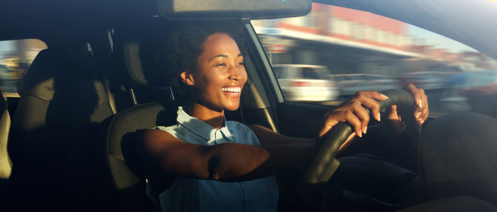 Woman smiling while driving