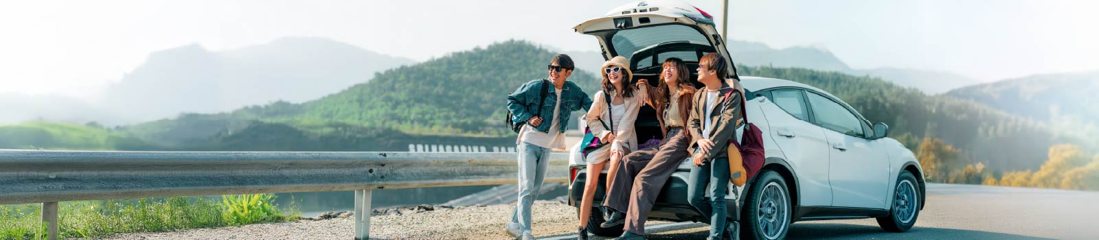 two women and two men smiling and talking