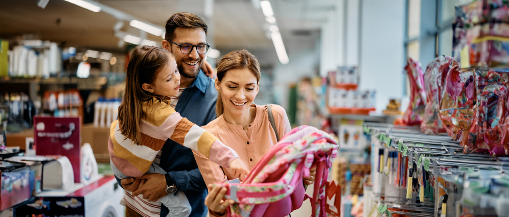 Parents shopping for a backpack with a child