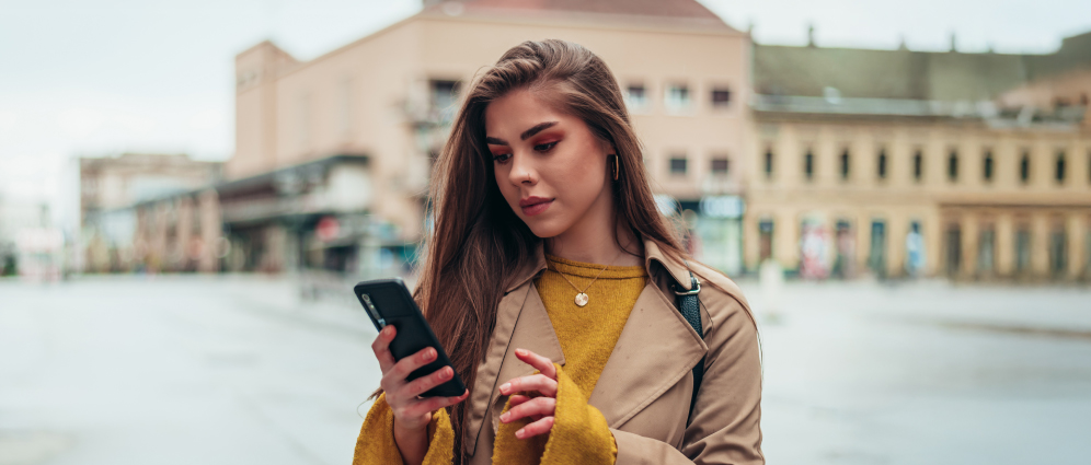 Woman looking at mobile device screen